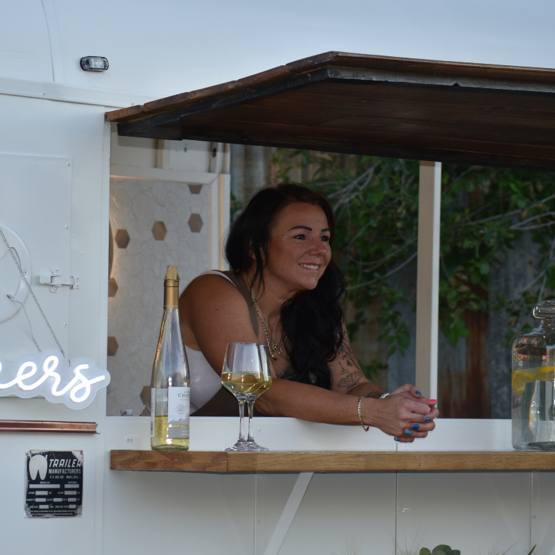 Photo of Amberdee (Owner) behind the bar.