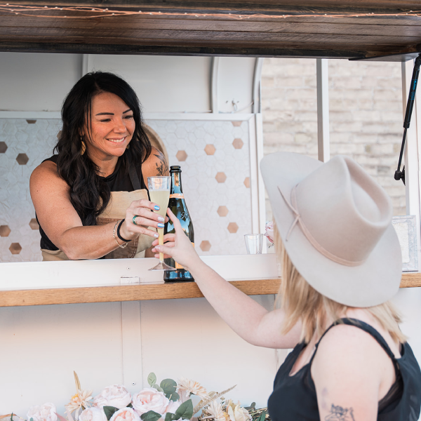 Photo of Katelynn (Bartender) and Amberdee (Owner) behind the bar.