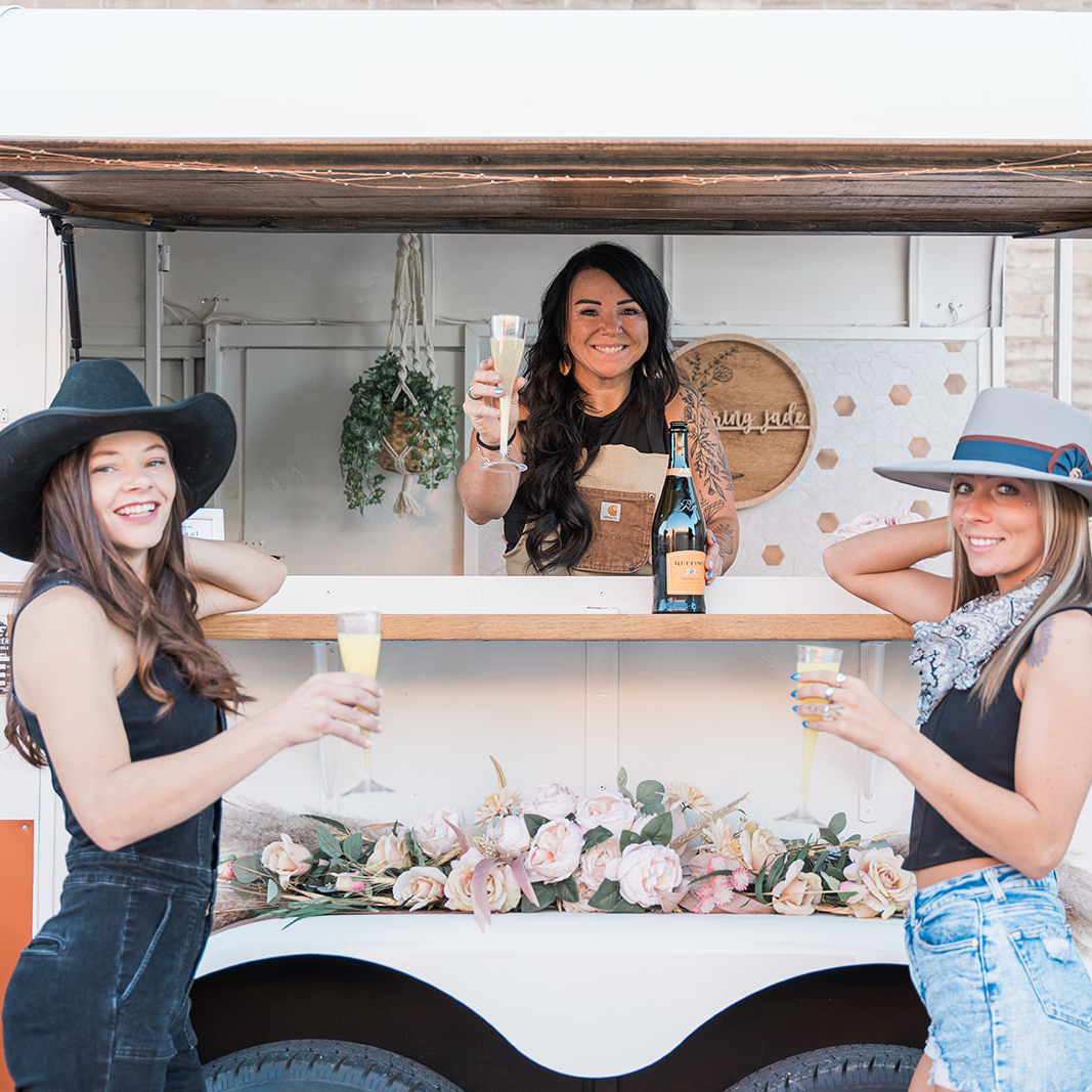 Photo of Amberdee (Owner) and KateLynn (Bartender) behind the counter.