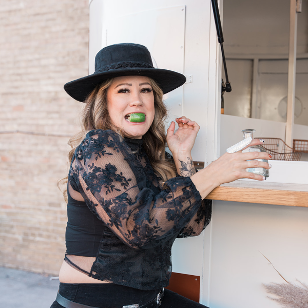 Photo of the Wandering Jade Trailer with bartenders serving drinks.