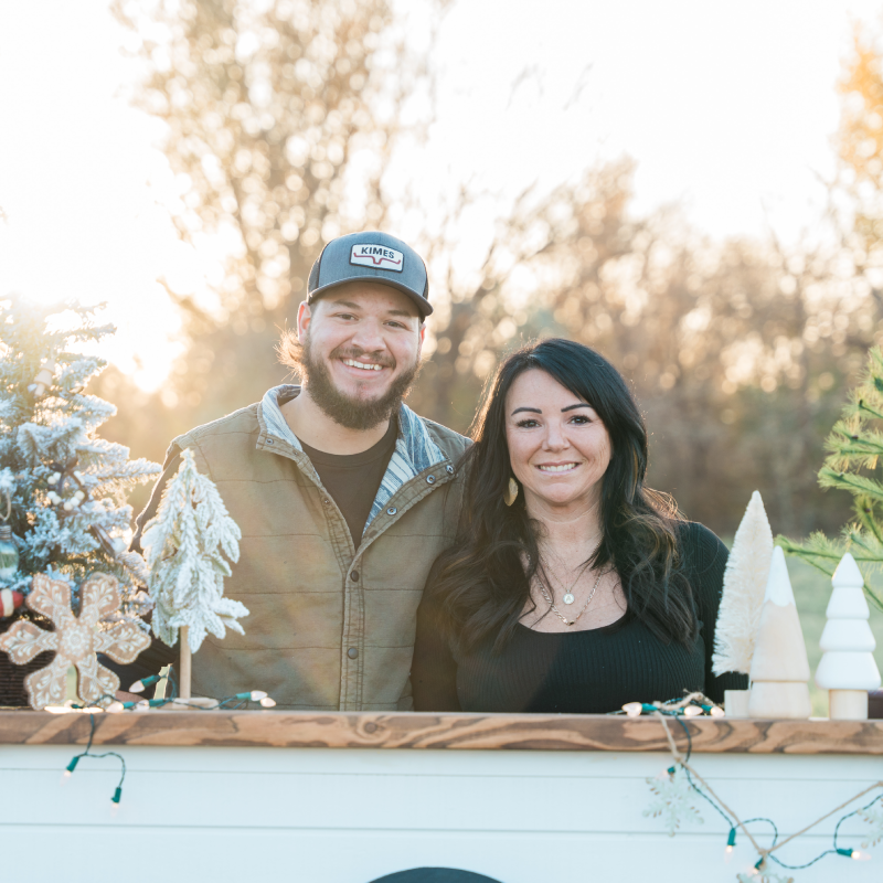 Photo of Amberdee (Owner) with Jake behind the bar.