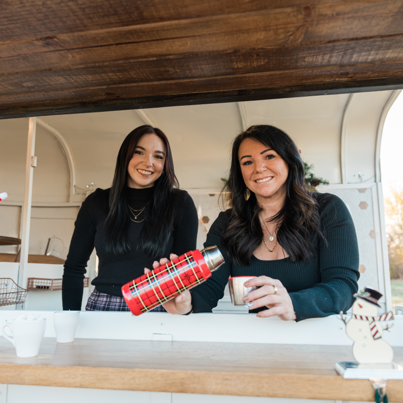 Photo of Katelynn (Bartender) and Amberdee (Owner) behind the bar.