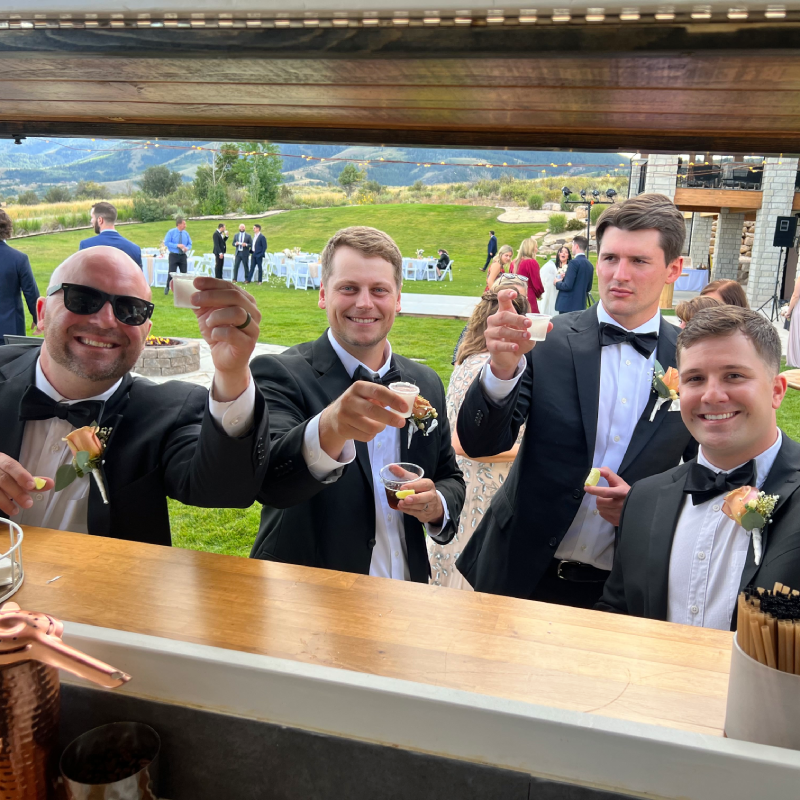 Photo of 4 men cheering at the Trailer.