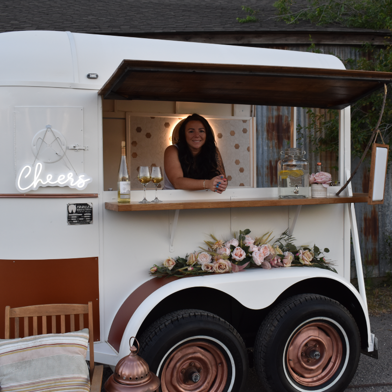 Photo of Amberdee (Owner) behind the counter.