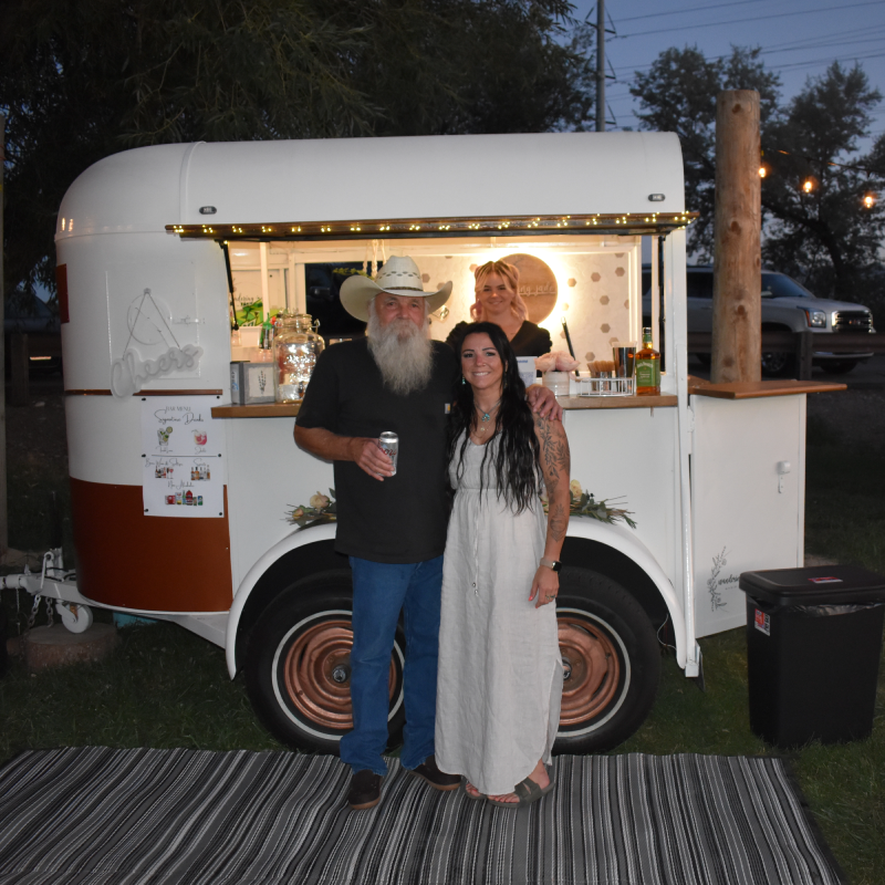 Photo of Amberdee (Owner) of the Wandering Jade standing with her Dad at the ribbon cutting.